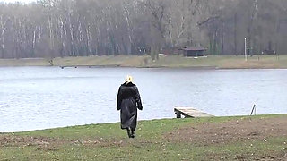 Bitch in leather pissing on a pier