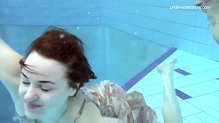 Two hot hairy babes underwater