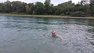 Sexy Granny Swims Naked in a Lake!