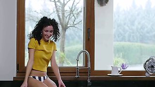Petite Hungarian babe exposes round tits
