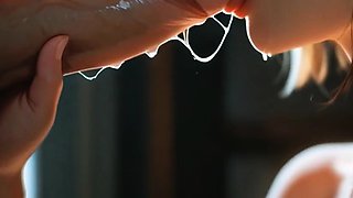 Black bob haired girl deepthroats cock in dim window room