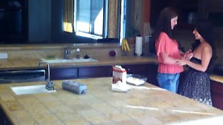 Horny milf eats teen pussy in the kitchen