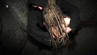 Clamps at the Body of a Tied up Moaning Witch
