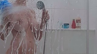 Busty curly brunette with big boobs fucks on couch