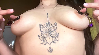 Kristi Ren whips herself with a flogger, stretches and puts clamps on her big nipples