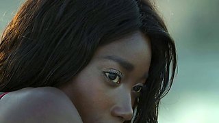Petite Ebony MILF strips naked in a pool