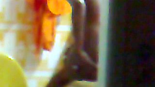 Hidden surveillance in the bathroom of an ebony woman with a nice body