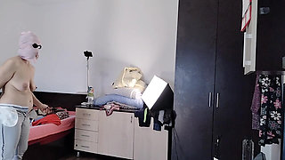 Amateur wife enjoys trying on clothes and cutting them. Amateur wife dances naked in the house.