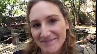 A shameless girl gives a blowjob in a park