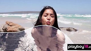 Cute nude asian babe posing at the beach