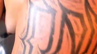 Latina Shakes Her Tattooed Butt