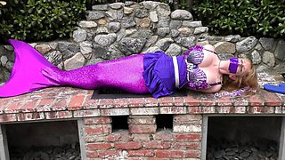 Enticing mermaid with big tits gets restrained and abandoned