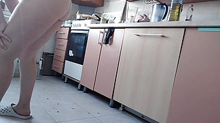 Sexy naked wife preparing food in the kitchen. Hairy brunette, big ass, big tits.