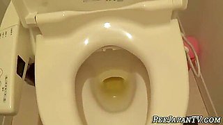 Asian Young Babe Pees In Toilet