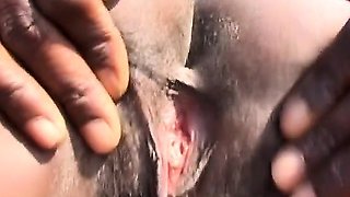 Rough outdoor spanking and tormenting with busty African