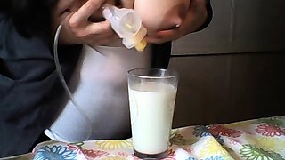 Hot babe with big boobs playing with her lactating boobs