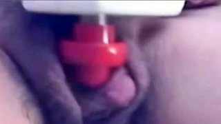 a woman pumps her clit into a dick