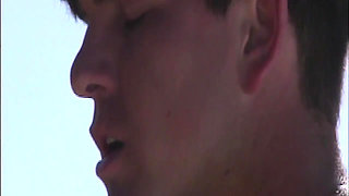 She Lies Naked on the Beach While He Watches Her