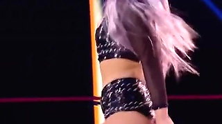 WWE - Liv Morgan posing between the ring ropes