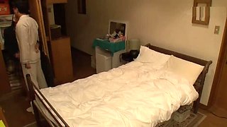 Japanese cutie gives handjob to her friend's dad in bed