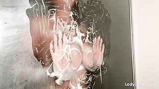 Soapy babe Lady Lyne exposes her gorgeous natural tits in the shower