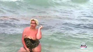 Monica Richard flashing at the beach