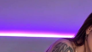 A babe in a rabbit mask shows her phat tits, plumbing