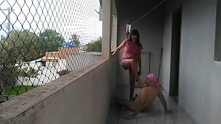 My wife teasing me on balcony