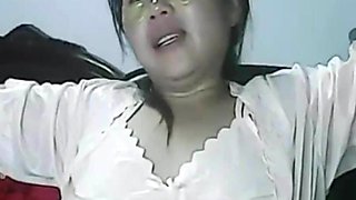 Wetting pussy of lonely Chinese MILF