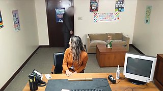 Busty housewife gags on principals dick at office